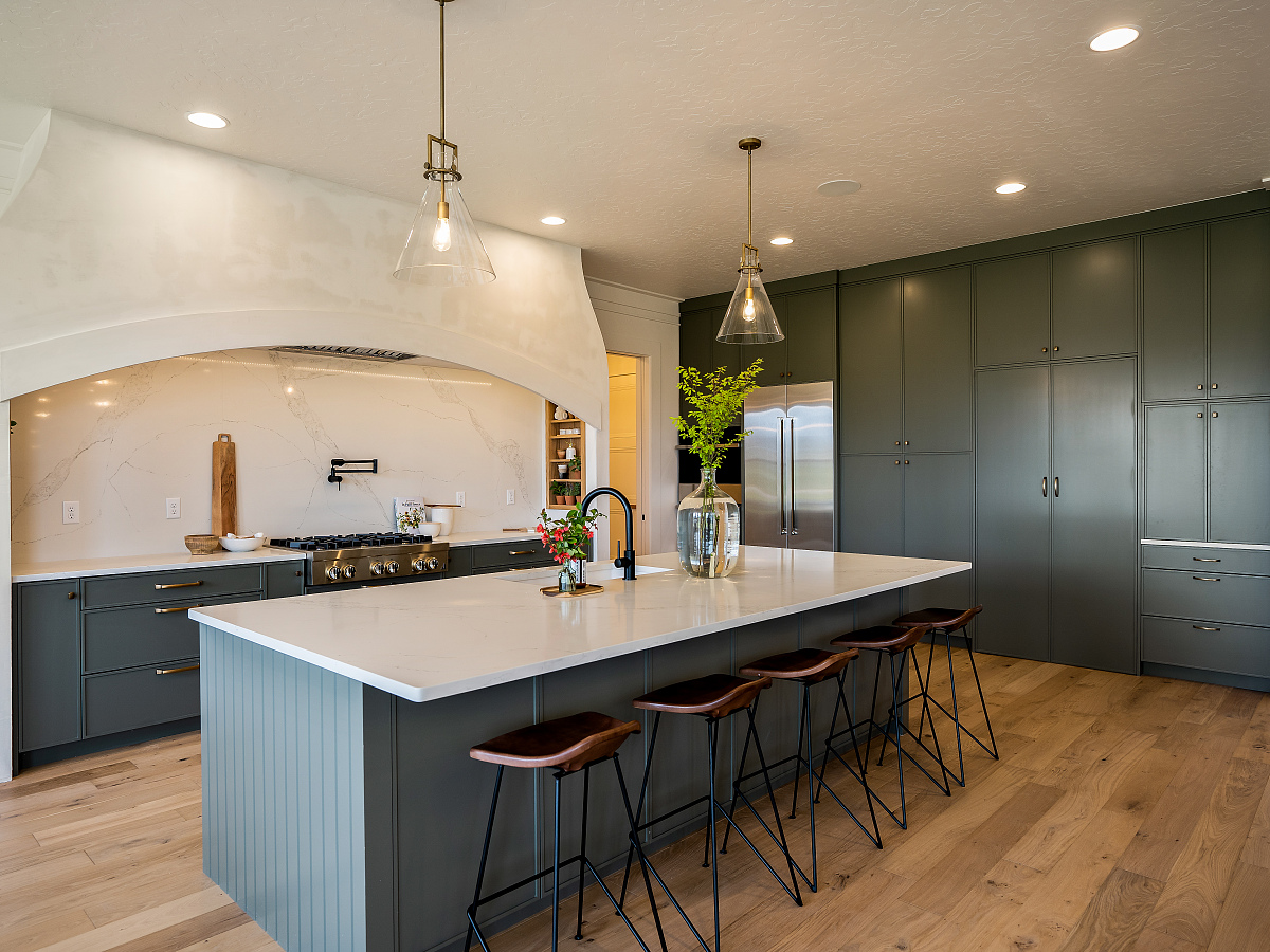 Gourmet kitchen with sage cabinets in the Vantage Homes Manhattan, Eagle Idaho